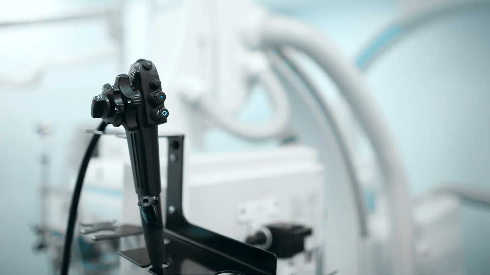A reprocessed endoscope resting on a stand in a clinical suite