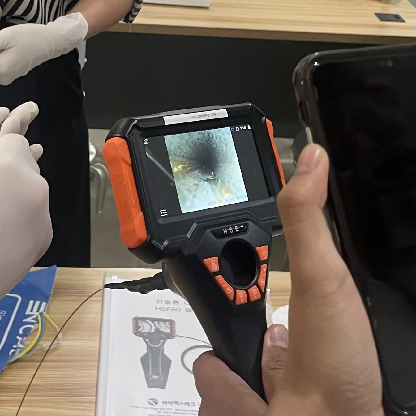 A borescope screen showing residue inside an endoscope channel